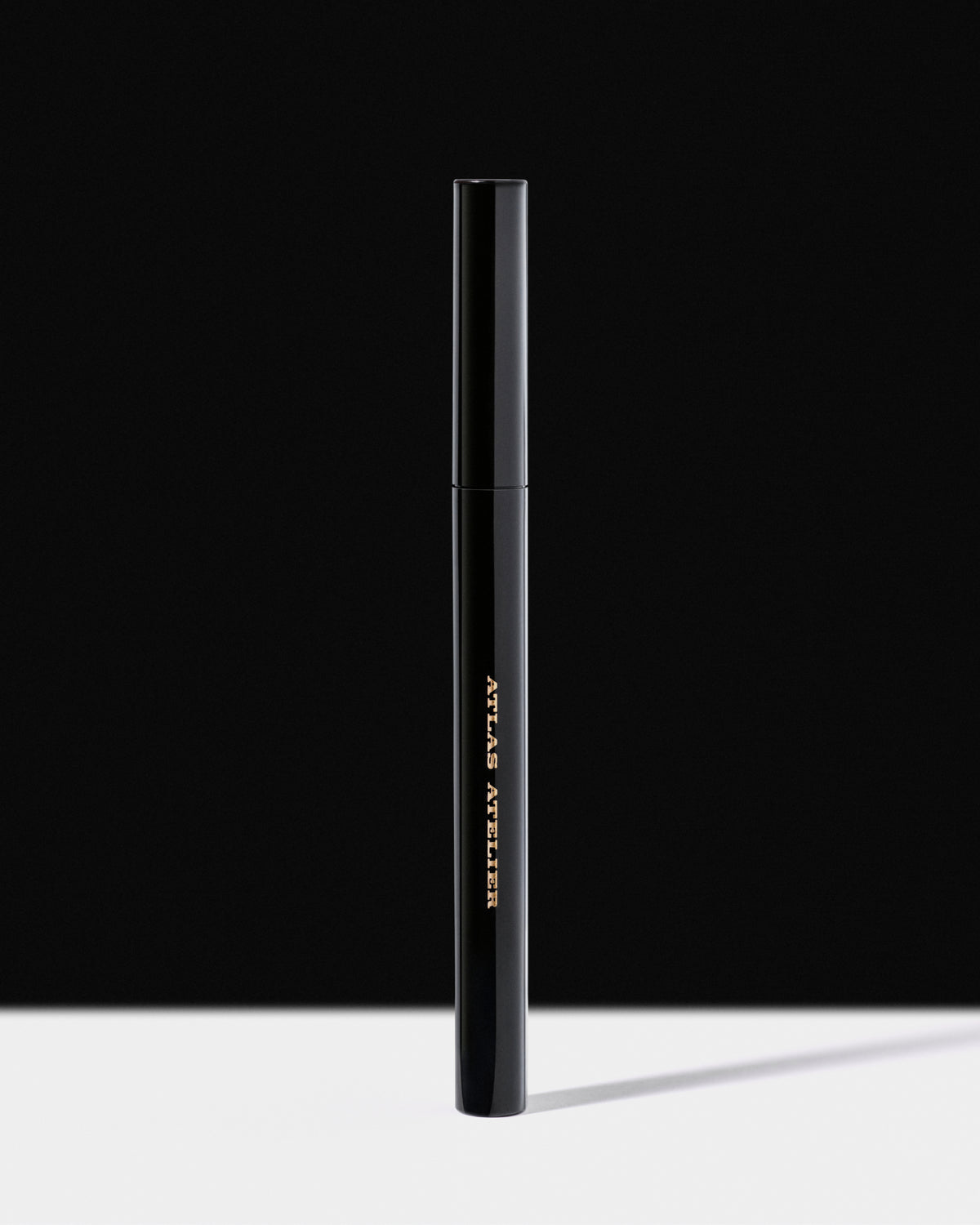 A tight photo of a woman's eye and a graphic black eyeliner